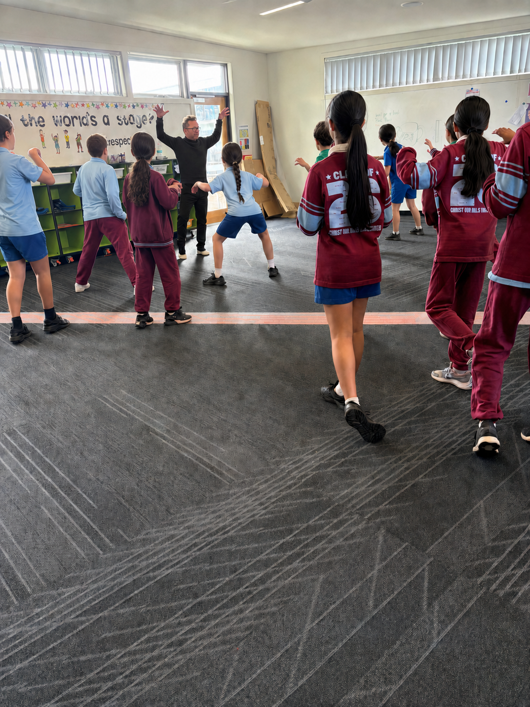 Jon leading primary students through a physical theatre workshop